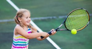 Child,Playing,Tennis,On,Outdoor,Court.,Little,Girl,With,Tennis
